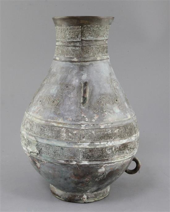A Chinese archaic bronze ritual drinking vessel, Hu, 6th century B.C., 31cm